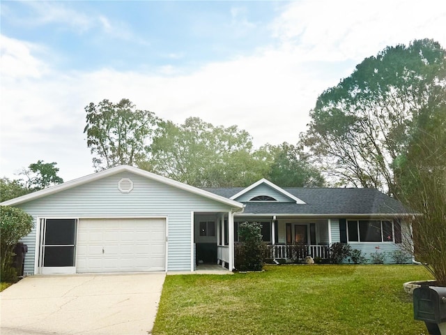 ranch-style home with a garage, a front yard, and covered porch