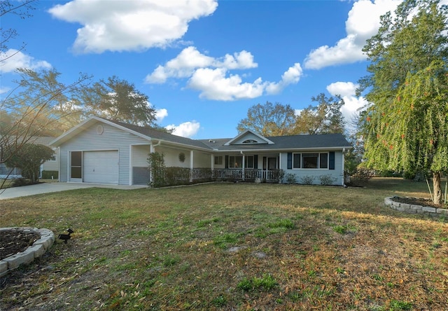 ranch-style home featuring a garage, covered porch, and a front lawn