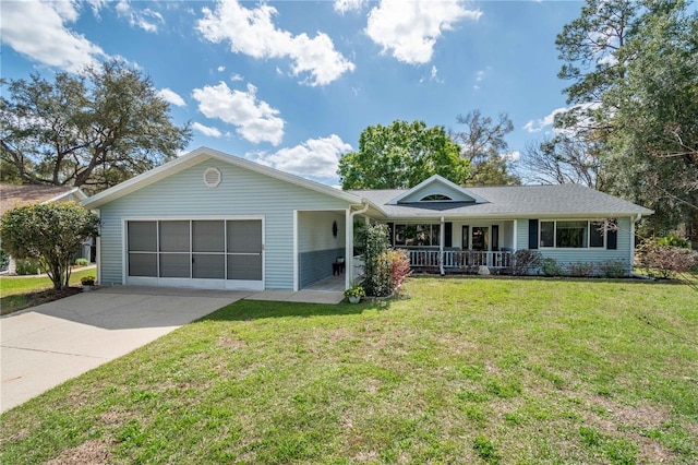 single story home featuring a front yard, concrete driveway, covered porch, and an attached garage