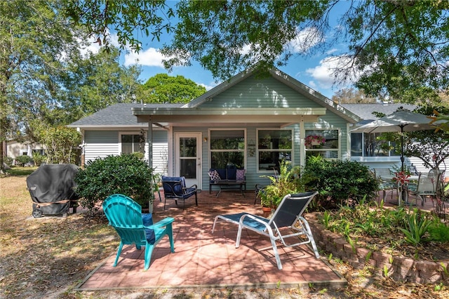 back of property with a patio area