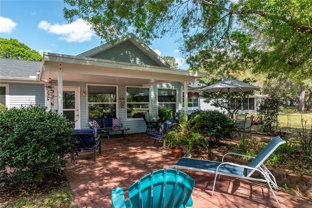 back of property featuring a patio area