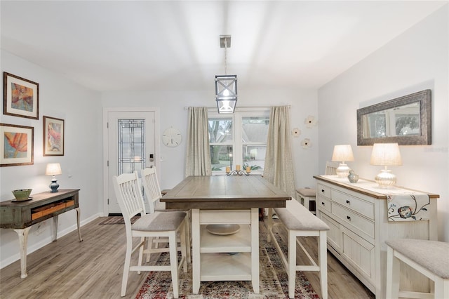 dining space with light hardwood / wood-style floors