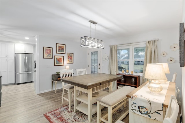 dining space featuring light hardwood / wood-style flooring