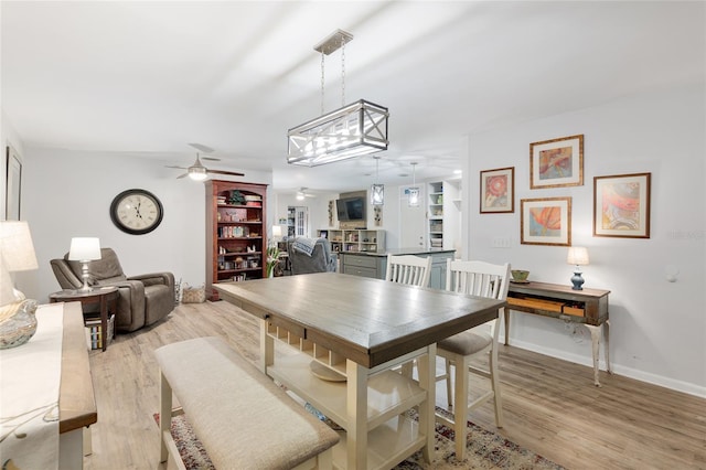 dining area featuring ceiling fan and light hardwood / wood-style floors