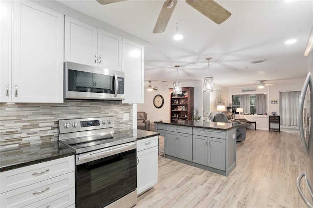 kitchen with gray cabinets, white cabinetry, and stainless steel appliances