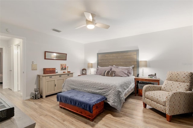 bedroom with ceiling fan and light hardwood / wood-style floors