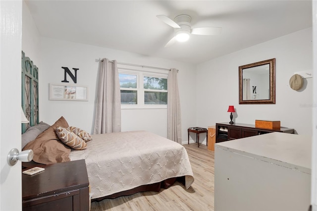 bedroom featuring light hardwood / wood-style flooring and ceiling fan