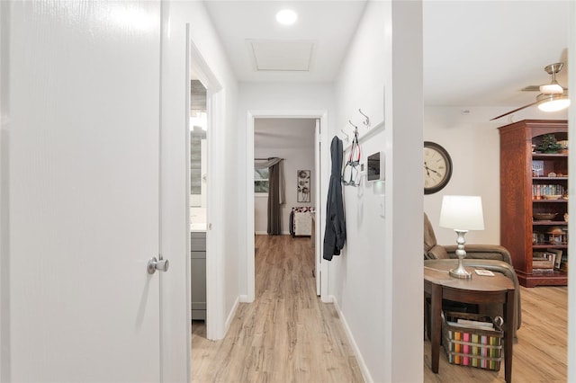 hall with light hardwood / wood-style flooring