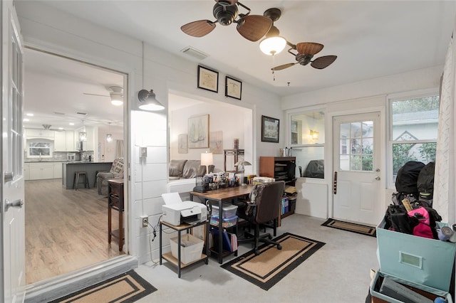 office featuring ceiling fan and sink