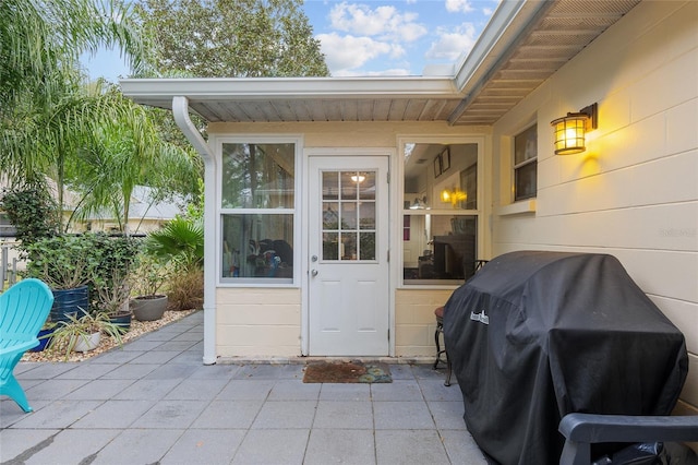 property entrance with a patio area