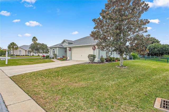 single story home featuring a garage and a front lawn