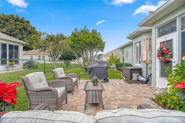 view of patio featuring a grill