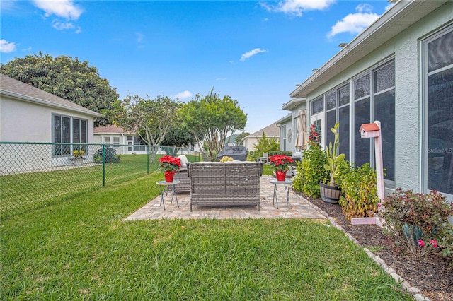 view of yard featuring an outdoor living space and a patio area