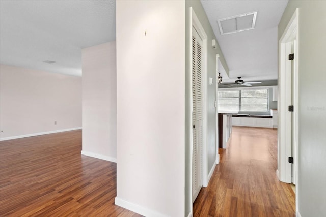 hallway with wood-type flooring