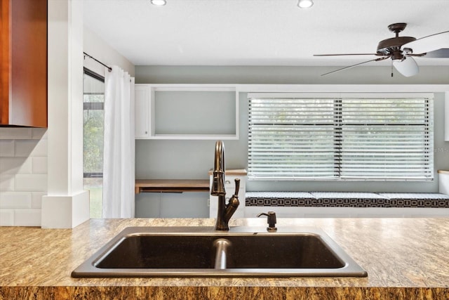 kitchen with sink, a healthy amount of sunlight, and ceiling fan