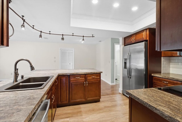 kitchen with crown molding, decorative backsplash, sink, light wood-type flooring, and stainless steel appliances