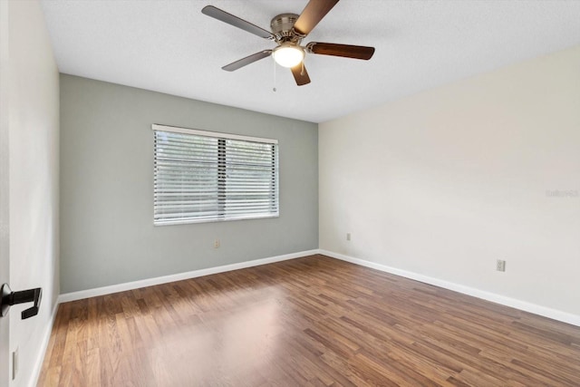 unfurnished room with hardwood / wood-style flooring, a textured ceiling, and ceiling fan