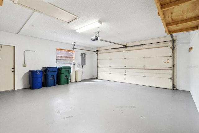 garage with electric panel and a garage door opener