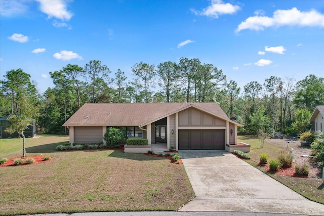 ranch-style house featuring a garage and a front yard