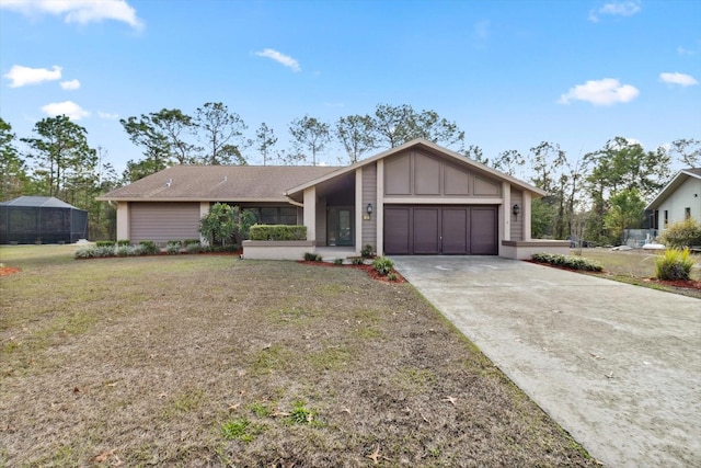 single story home featuring a front yard and a garage