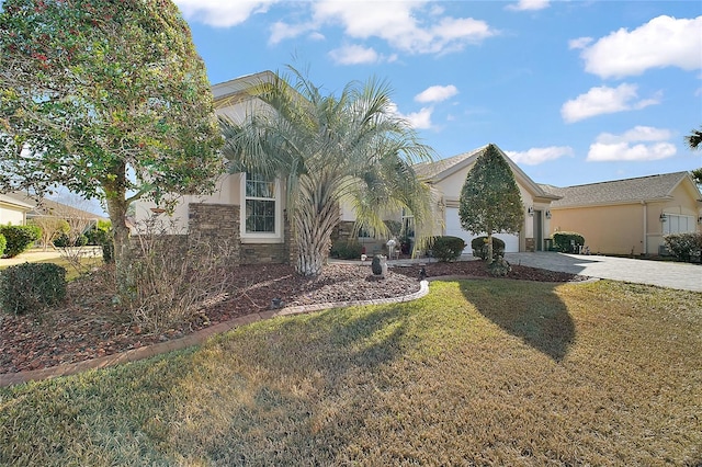 view of front facade with a garage and a front yard