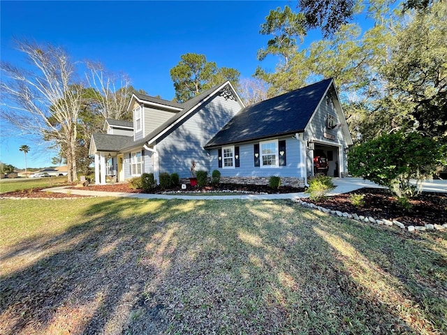 view of front of home featuring a garage and a front yard