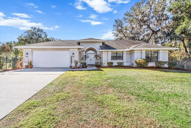 single story home with a garage and a front lawn