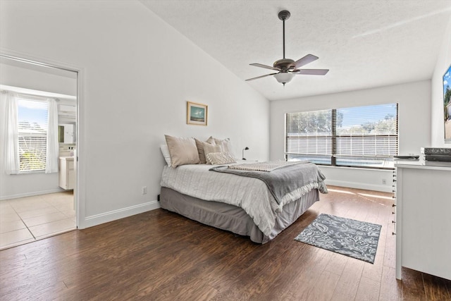 bedroom with hardwood / wood-style flooring, lofted ceiling, and ceiling fan