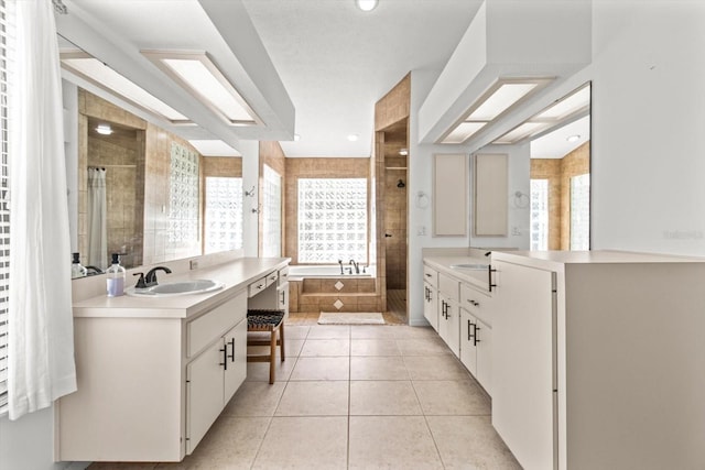 bathroom with vanity, plenty of natural light, and tile patterned floors