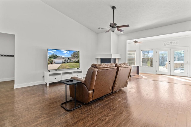 living room with french doors, ceiling fan, dark hardwood / wood-style flooring, and high vaulted ceiling