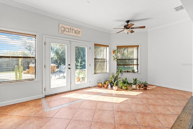 doorway with french doors, ceiling fan, crown molding, and light tile patterned floors