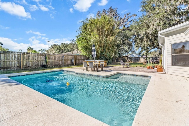 view of pool featuring a patio