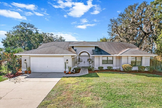 single story home with a garage and a front yard