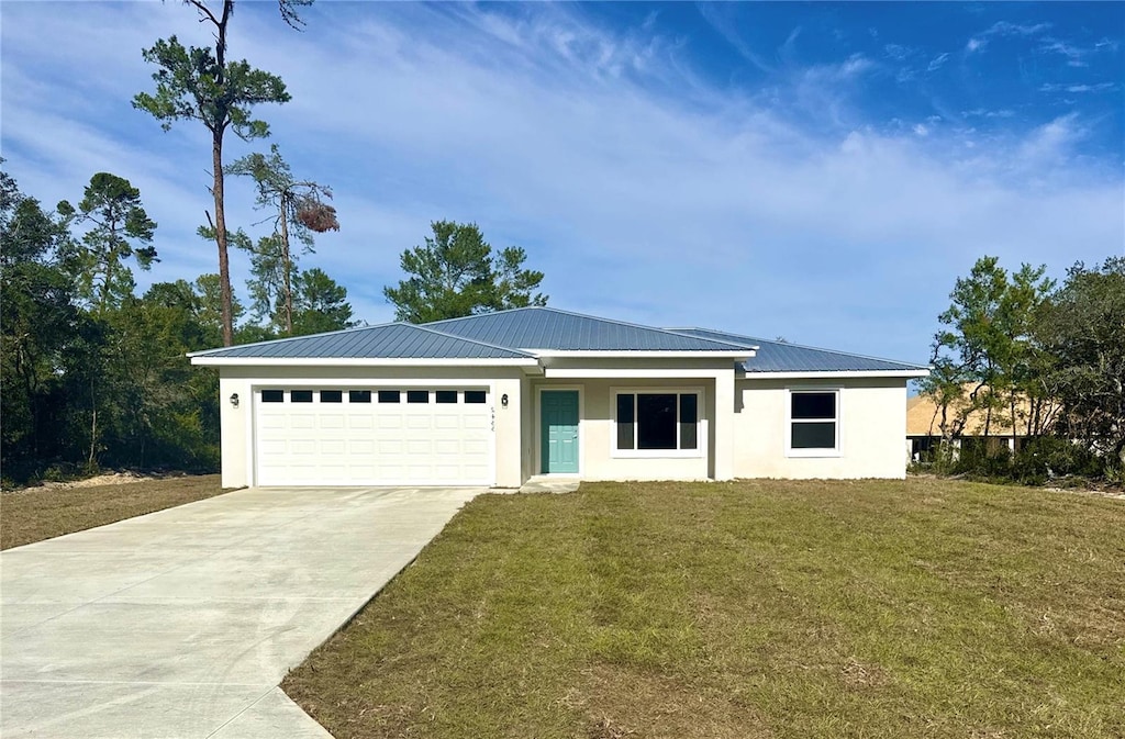 ranch-style home with a garage and a front yard