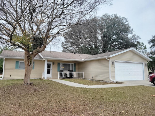 ranch-style home with a garage, a front lawn, and a porch