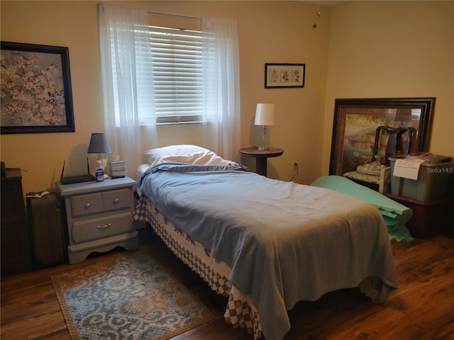 bedroom featuring dark hardwood / wood-style floors