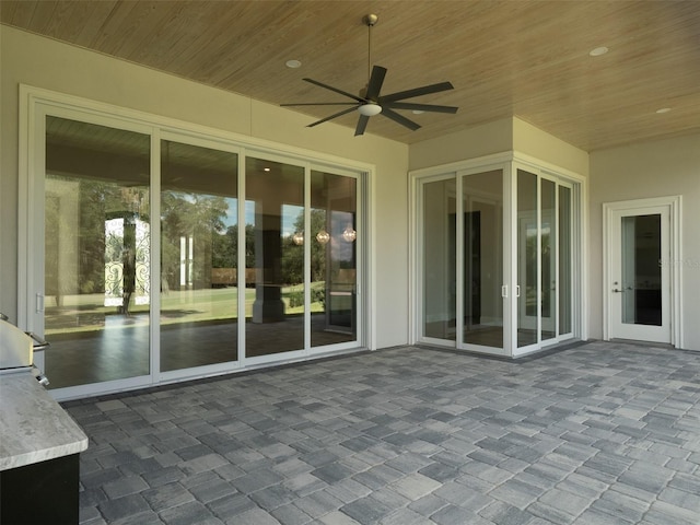 view of patio featuring ceiling fan