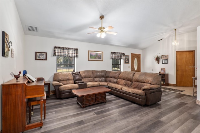 living room with vaulted ceiling, dark wood-type flooring, and ceiling fan