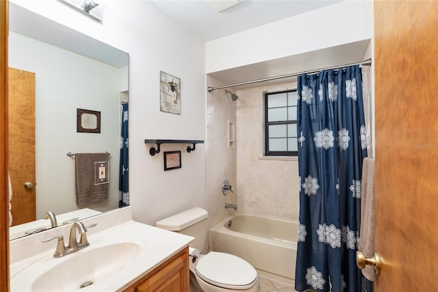 full bathroom featuring tile patterned floors, vanity, toilet, and shower / tub combo