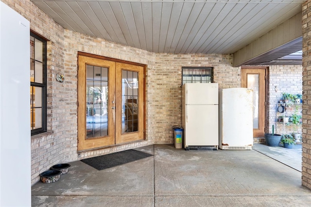 property entrance featuring french doors