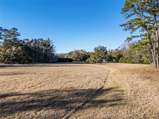 view of property's community with a lawn