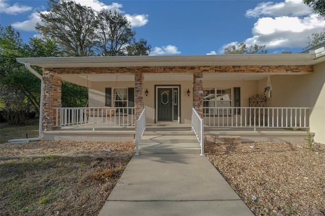 entrance to property with covered porch