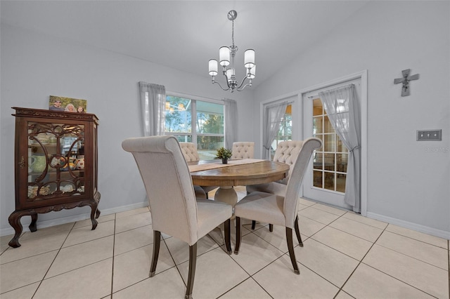 tiled dining room with french doors, lofted ceiling, and a notable chandelier