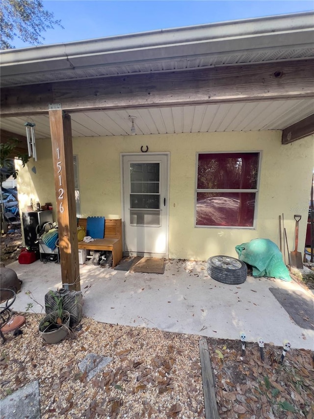 doorway to property featuring a patio