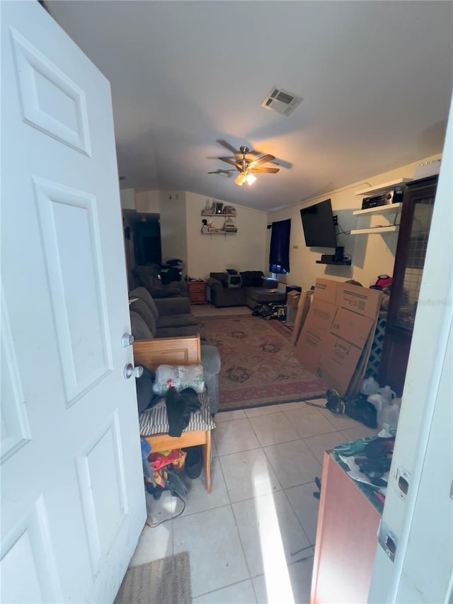 interior space featuring ceiling fan and light tile patterned floors