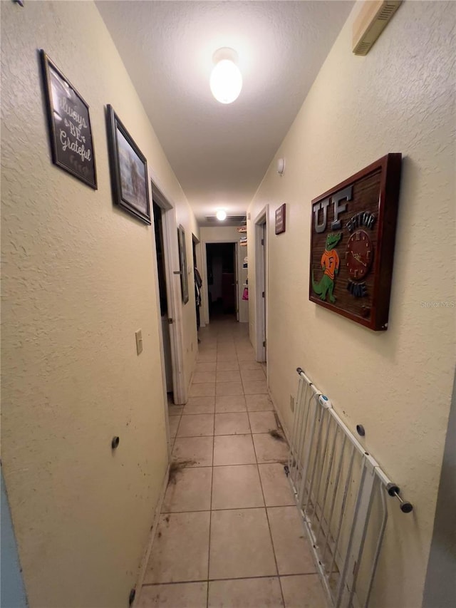 hallway featuring light tile patterned floors