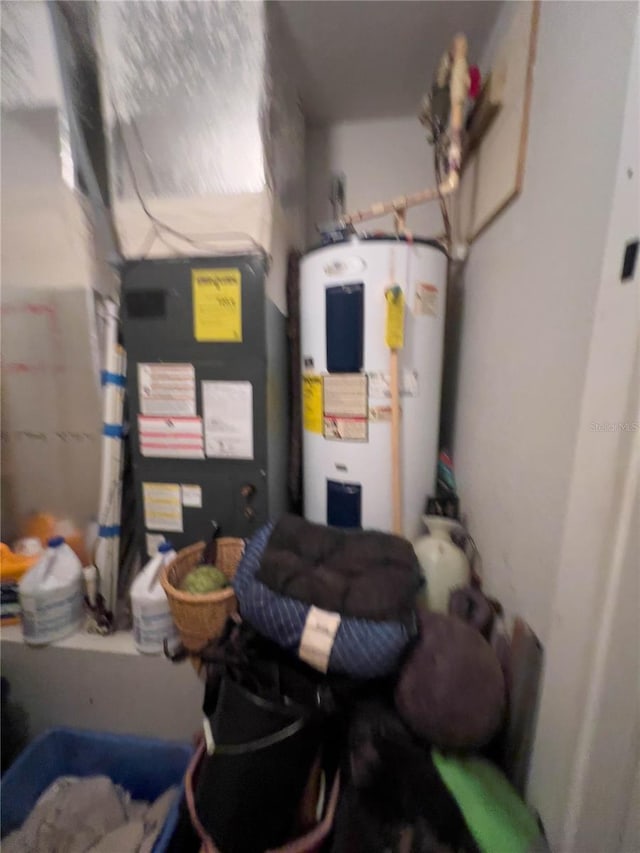 utility room featuring electric water heater