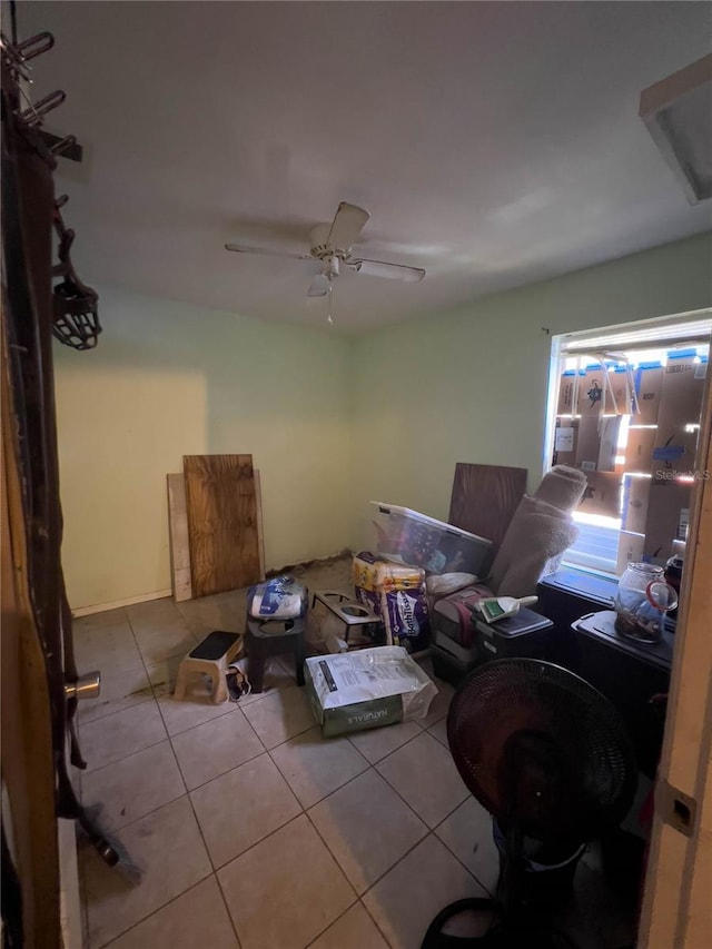 miscellaneous room featuring ceiling fan and light tile patterned floors