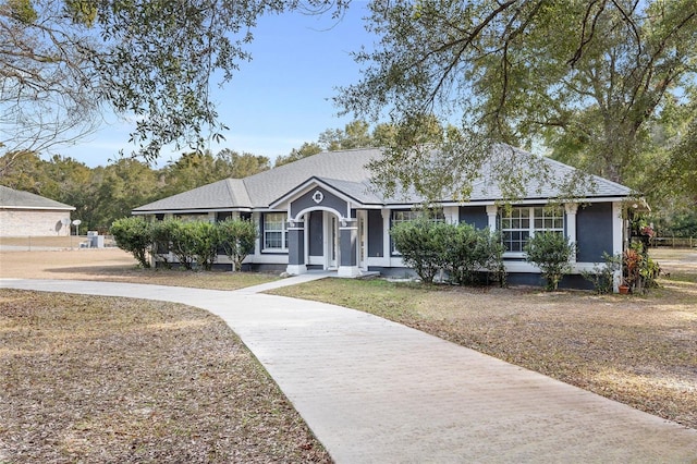 ranch-style house with a front yard