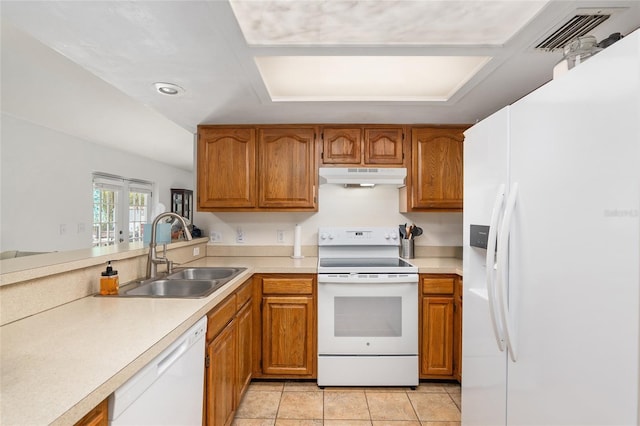 kitchen featuring sink, white appliances, light tile patterned floors, and french doors